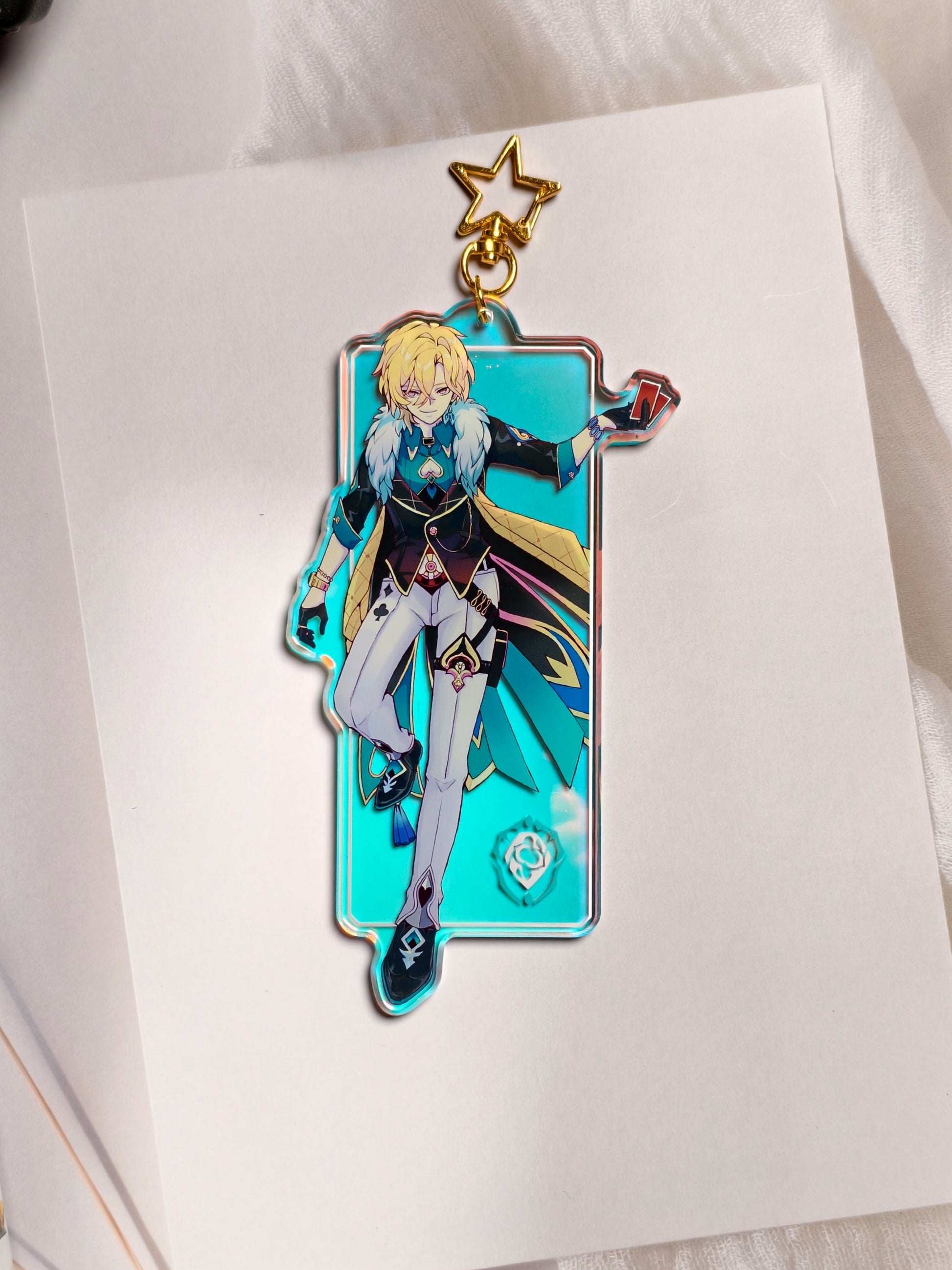 Aventurine from Honkai Star Rail rainbow holographic acrylic bag charm styled with gold star clasp.